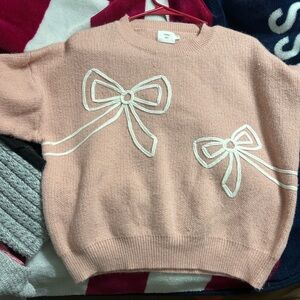 Chic Pink Sweater with Elegant Bow Accents